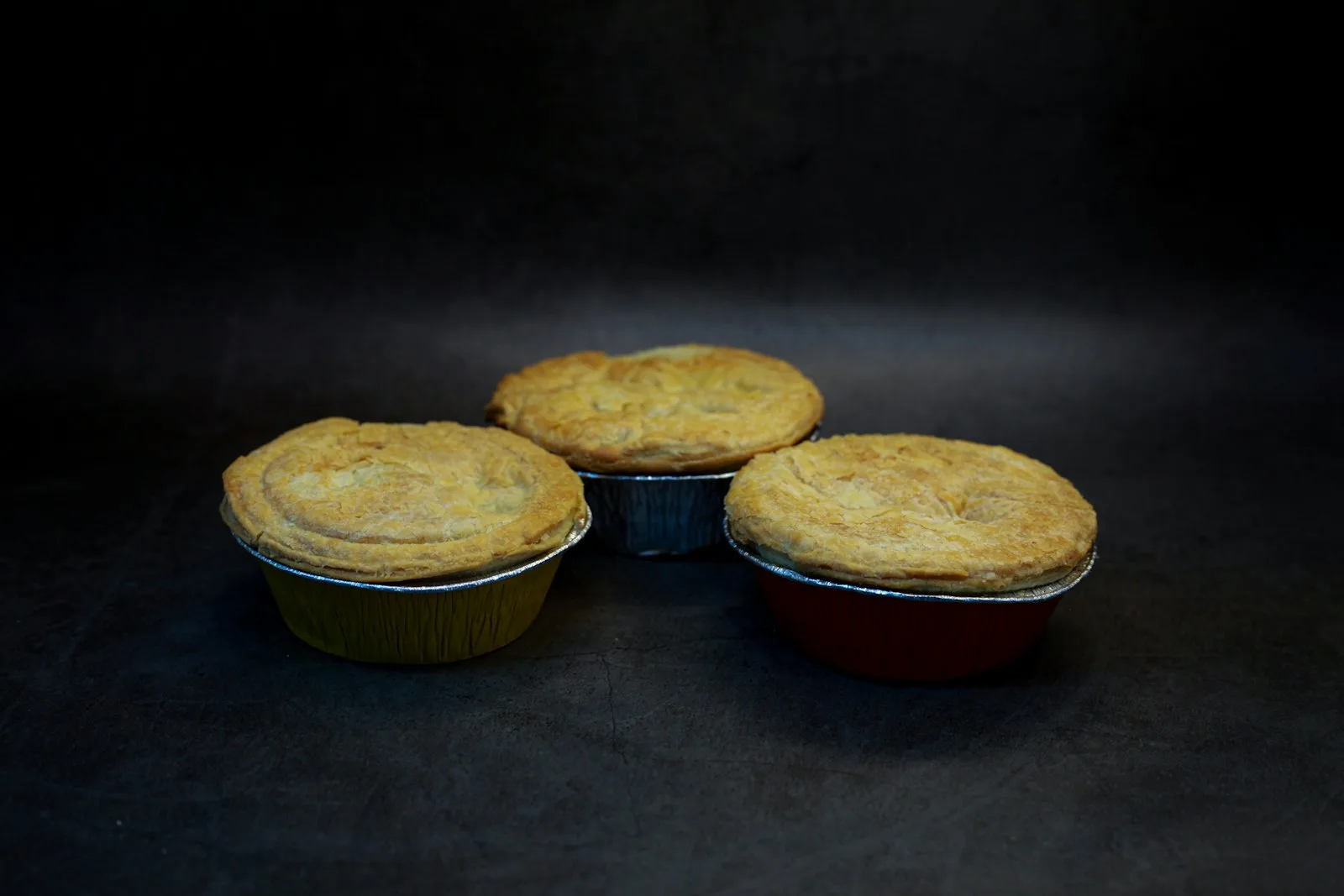 Golden baked meat pies ready to serve